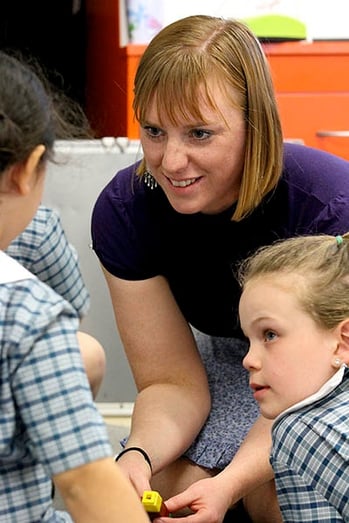 Mum helping small class group Mum helping small class group